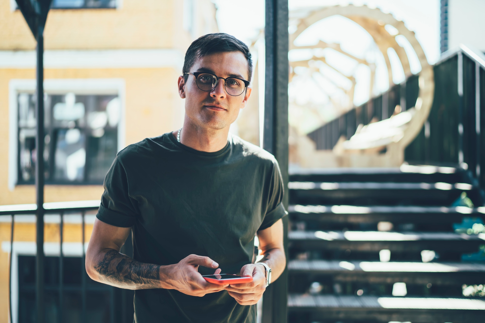 Caucasian hipster guy spending time for mobility with new gadget