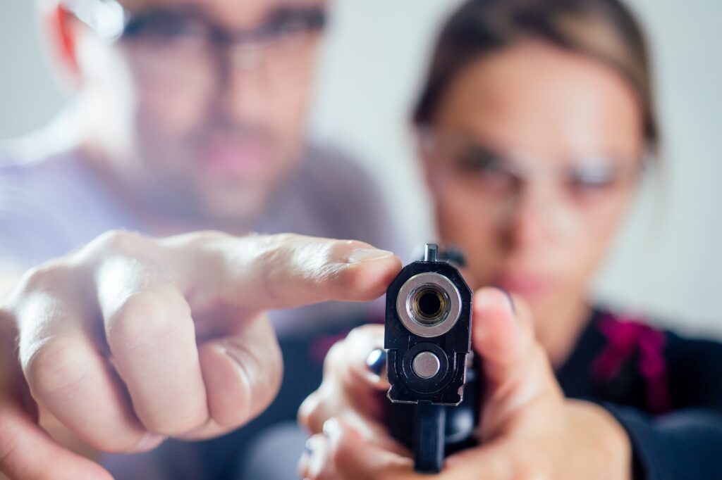 people learning to use the guns. self defense local defense concept