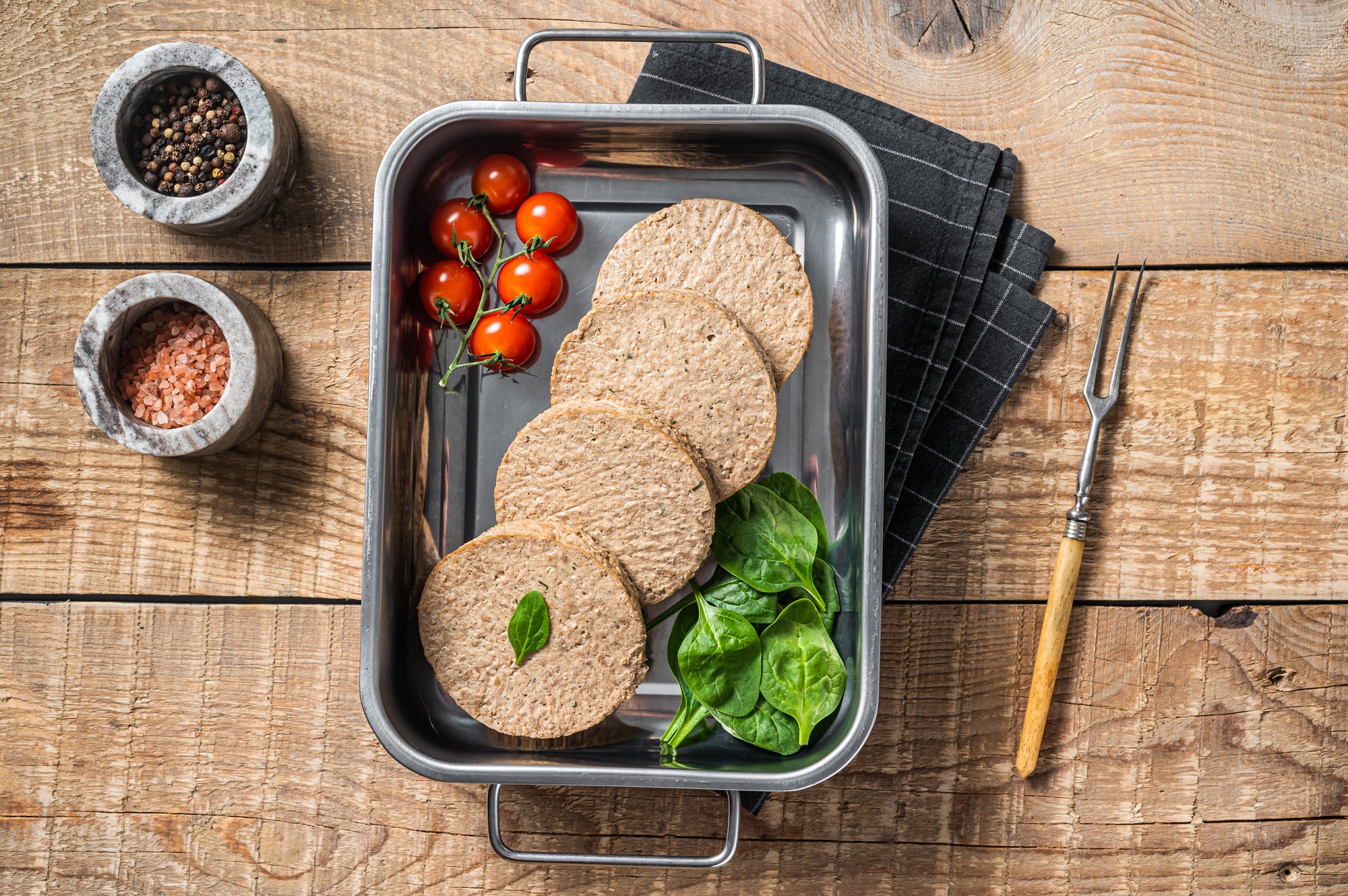 Raw meat free patties made from plant based meat, fresh vegan burger cutlets